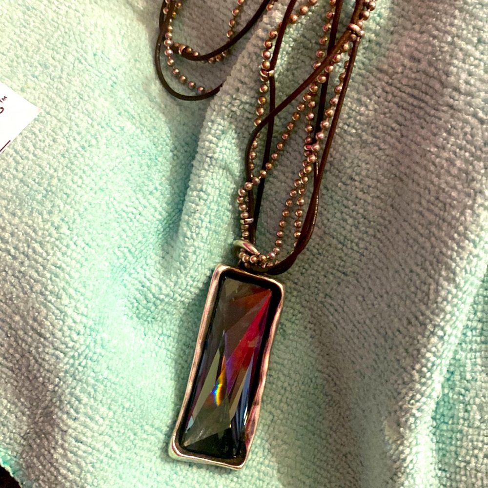 12" Sterling silver and leather necklace.       uno maker